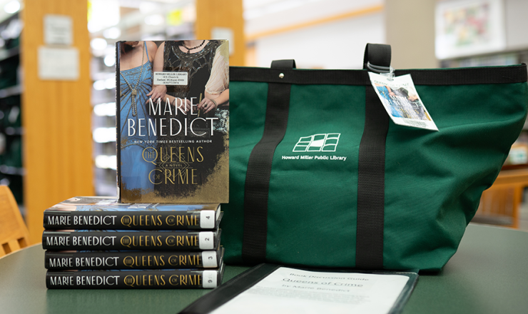 Book club kit showing a tote bag and five copies of the same book