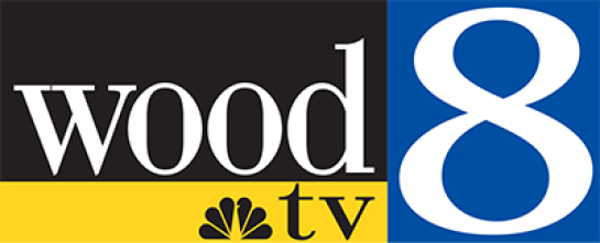 Wood TV 8 logo with black, blue, and yellow backgrounds